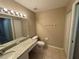 Bathroom with granite countertops and updated fixtures at 5330 Hyland Hills Ave # 2314, Sarasota, FL 34241