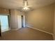 Bedroom with carpet and ceiling fan at 5330 Hyland Hills Ave # 2314, Sarasota, FL 34241