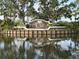 Community entrance sign, surrounded by water and lush landscaping, welcomes residents and visitors at 5330 Hyland Hills Ave # 2314, Sarasota, FL 34241