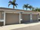 Attached garages feature neutral doors with unit numbers and modern lighting fixtures at 5330 Hyland Hills Ave # 2314, Sarasota, FL 34241