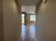Hallway featuring tile floors leading to an outdoor area at 5330 Hyland Hills Ave # 2314, Sarasota, FL 34241