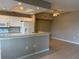Bright kitchen with white cabinetry, granite countertops, and stainless steel appliances at 5330 Hyland Hills Ave # 2314, Sarasota, FL 34241