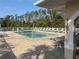 Community swimming pool with plenty of lounge chairs and shade at 5330 Hyland Hills Ave # 2314, Sarasota, FL 34241