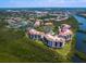 Panoramic aerial view of the community, showcasing the condos, waterways, and meticulously landscaped grounds at 5430 Eagles Point Cir # 101, Sarasota, FL 34231