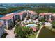 Aerial view showcasing the complex, pool, and beautiful waterfront location at 5430 Eagles Point Cir # 101, Sarasota, FL 34231