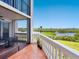 Balcony view overlooking the river, showcasing the railing and tile flooring at 5430 Eagles Point Cir # 101, Sarasota, FL 34231