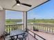 A peaceful view from the balcony overlooking a tranquil river and lush greenery at 5430 Eagles Point Cir # 101, Sarasota, FL 34231
