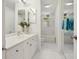 Clean bathroom with modern white vanity, walk-in shower, and updated fixtures at 5430 Eagles Point Cir # 101, Sarasota, FL 34231