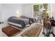 Bright bedroom featuring two twin beds, updated flooring, and a bicycle at 5430 Eagles Point Cir # 101, Sarasota, FL 34231