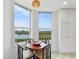 Breakfast nook with windows overlooking water at 5430 Eagles Point Cir # 101, Sarasota, FL 34231