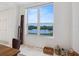 Bright dining area featuring a large window with a picturesque view of the waterfront at 5430 Eagles Point Cir # 101, Sarasota, FL 34231