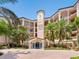 The building's exterior boasts a stucco facade, beautiful landscaping, and a welcoming entrance at 5430 Eagles Point Cir # 101, Sarasota, FL 34231