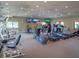 Bright gym with several treadmills, elliptical machines, and other weight training equipment with flat-screen TVs at 5430 Eagles Point Cir # 101, Sarasota, FL 34231