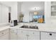Bright kitchen with stainless steel sink and appliances plus pass-through to dining room at 5430 Eagles Point Cir # 101, Sarasota, FL 34231