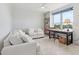 Bright living room featuring a work space and a beautiful view of the surrounding area at 5430 Eagles Point Cir # 101, Sarasota, FL 34231