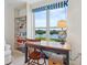 Bright study room featuring a desk, shelving, and a beautiful view of the surrounding area at 5430 Eagles Point Cir # 101, Sarasota, FL 34231