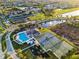 Birds eye view of the community clubhouse, pool, playground, tennis courts, and basketball court at 5439 74Th E Pl, Ellenton, FL 34222