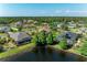 A tranquil pond and scenic neighborhood with lush landscaping and mature trees at 5439 74Th E Pl, Ellenton, FL 34222