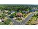 Lovely aerial view of a home with brick driveway, lush tropical landscaping and side-entry garages at 5439 74Th E Pl, Ellenton, FL 34222