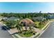 Beautiful aerial view of a home with brick driveway, lush landscaping and side-entry garages at 5439 74Th E Pl, Ellenton, FL 34222