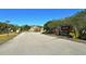 Gated entrance to the Oakleaf Hammock community for privacy and security, with lush landscaping at 5439 74Th E Pl, Ellenton, FL 34222