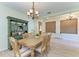 Inviting dining area features a chandelier and an antique hutch, perfect for Gathering gatherings at 5439 74Th E Pl, Ellenton, FL 34222
