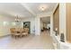 Elegant dining room featuring wood floors, chandelier, and decorative hutch at 5439 74Th E Pl, Ellenton, FL 34222