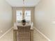A dining room with a wood table, chandelier, and shuttered windows at 5439 74Th E Pl, Ellenton, FL 34222