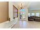 Elegant foyer featuring double doors, high ceilings, a chandelier, and decorative accents at 5439 74Th E Pl, Ellenton, FL 34222