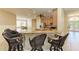 Kitchen featuring a bar top, light wood cabinets, and stainless steel appliances at 5439 74Th E Pl, Ellenton, FL 34222