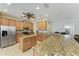 Kitchen with granite countertops, stainless steel appliances and tile backsplash at 5439 74Th E Pl, Ellenton, FL 34222
