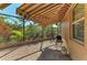 Covered patio with brick pavers, retractable awning, and a screened enclosure offering a private outdoor space at 5439 74Th E Pl, Ellenton, FL 34222