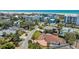 Aerial view of a home with fenced in yard and red brick driveway near the beach at 5522 Calle Del Verano, Sarasota, FL 34242