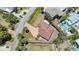 Aerial view of the property highlighting the brick-red roof, driveway, and neighborhood at 5522 Calle Del Verano, Sarasota, FL 34242