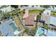 Aerial view of a home with fenced in yard and red brick driveway at 5522 Calle Del Verano, Sarasota, FL 34242