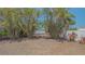 A view from the backyard showing some of the landscaping and fence at 5522 Calle Del Verano, Sarasota, FL 34242