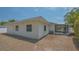 The back corner of the house shows the screened in porch with limited landscaping at 5522 Calle Del Verano, Sarasota, FL 34242