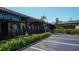 Exterior view of Siesta Key Wine Bar with outdoor seating and greenery along the storefront at 5522 Calle Del Verano, Sarasota, FL 34242