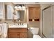 Bathroom featuring a single vanity, mirror, medicine cabinet, and tiled walk-in shower at 600 Manatee Ave # 143, Holmes Beach, FL 34217