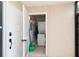 Laundry room with a stacked washer and dryer set located next to the entrance at 600 Manatee Ave # 143, Holmes Beach, FL 34217