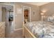 Serene main bedroom featuring a view of the bathroom, hallway, and a queen size bed at 600 Manatee Ave # 143, Holmes Beach, FL 34217