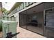 Screened patio features tile floors and ample space, ideal for a grill and outdoor seating at 600 Manatee Ave # 143, Holmes Beach, FL 34217