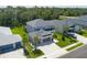 Beautiful two-story home aerial view with a three-car garage, and lush landscaping at 6017 Maidenstone Way, Palmetto, FL 34221