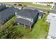 Aerial shot of the backyard featuring a screened patio and lush landscaping, offering privacy at 6017 Maidenstone Way, Palmetto, FL 34221