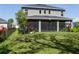Expansive backyard featuring a lush lawn and a screened-in patio for outdoor enjoyment at 6017 Maidenstone Way, Palmetto, FL 34221