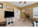 Cozy bedroom with an open door leading to another room with ample natural light at 6017 Maidenstone Way, Palmetto, FL 34221