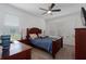 A primary bedroom with neutral walls, carpeting, and a ceiling fan at 6017 Maidenstone Way, Palmetto, FL 34221