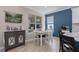 Eat-in kitchen/dining room features neutral walls, wood floors, a dining table, and a kitchen at 6017 Maidenstone Way, Palmetto, FL 34221