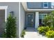 Inviting entryway features a stylish door, manicured shrubs, and charming 'no soliciting' sign at 6017 Maidenstone Way, Palmetto, FL 34221
