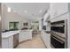 Bright, modern kitchen with stainless steel appliances, ample counter space, and stylish cabinetry at 6017 Maidenstone Way, Palmetto, FL 34221